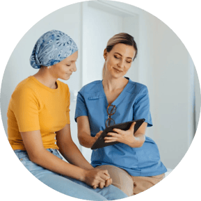 Teenage oncology patient talking with doctor. Oncologist treating teen girl with cancer and provide emotional support, helping her with anxiety and depression.